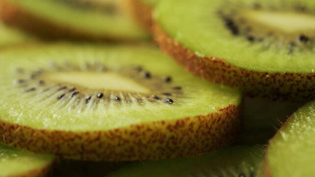 Close-up of kiwi fruit slices. Kiwi is low in calories and high in fiber, making a good choice for weight management.