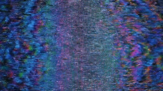 A close-up view of a screen with colorful pixel distortion, showcasing electronic failure. Grid, spectrum hues