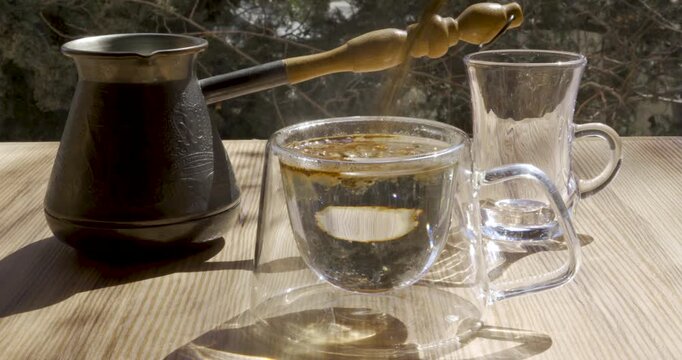 Instant coffee granules pouring and dissolving in hot water with steam Quality DCI 2K