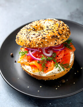 Delicious Lox Bagel Sandwich with Sesame Seeds Cream Cheese Dill and Red Onion
