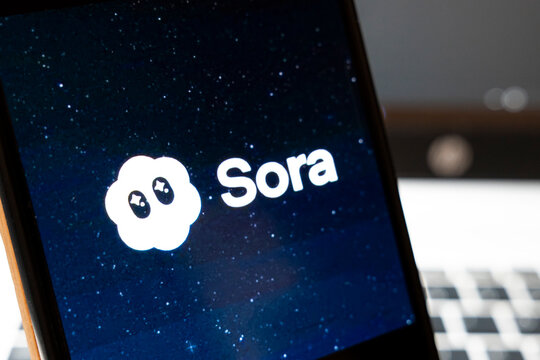 Warsaw, Poland - April 2, 2026: A close-up of a smartphone displaying the Sora logo surrounded by a starry background, highlighting technology and digital innovation.