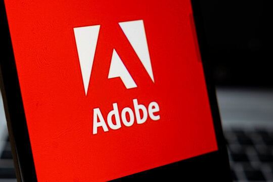 Warsaw, Poland - April 2, 2026: Close-up of the Adobe logo displayed on a screen, highlighting brand identity in digital media and creative technology environments.