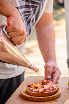 Pouring Olive Oil on Cooked Octopus] The Concept of Food Preparation