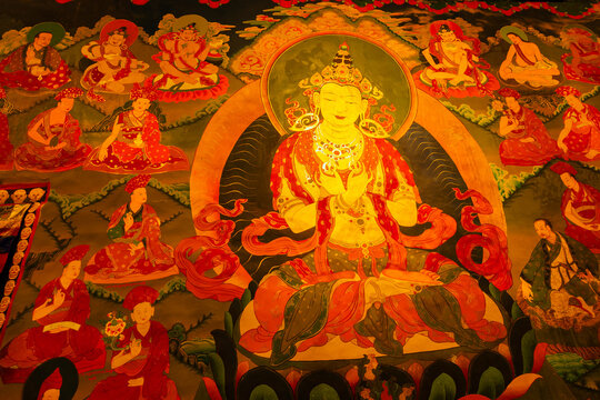 Hemis,Ladakh,India - 05.09.2014 : Thangka painting, traditional Tibetan Buddhist artwork of Chenrezig, Bodhisattva of Compassion, hands holding wish fulfilling jewel at heart, at Hemis Monastery.