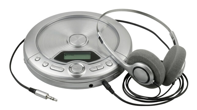 Portable CD player with headphones on black background