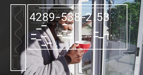 Holding red mug, senior man in gray bathrobe sipping, looking out to balcony with HUD overlay © vectorfusionart