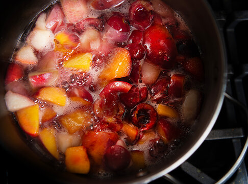 Peach, berries and cherries boiling 