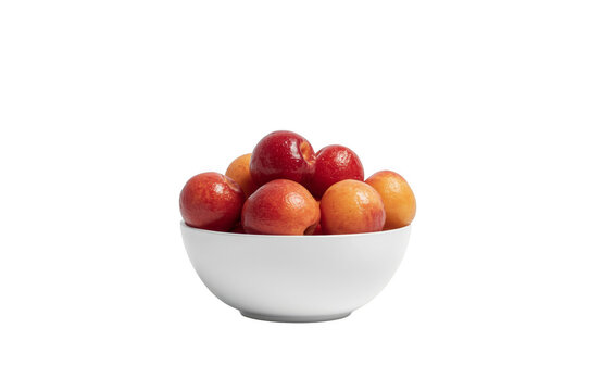 Bowl of fresh nectarine plums on transparent background