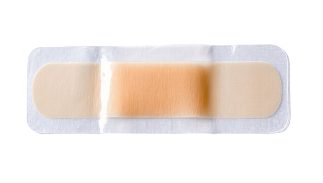 Isolated new beige adhesive bandage sealed in clear plastic packaging for effective medical care.