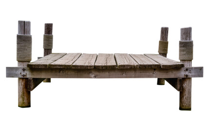 Isolated old wooden pier or small dock on posts wrapped with rope for boats and fishing © Corotaev