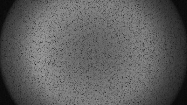 Abstract speckled texture background, noise pattern, digital grain effect, dark vintage overlay