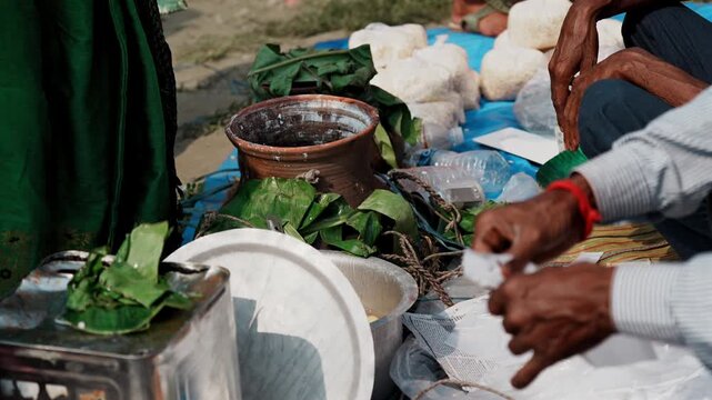 A street vendor sells rasgullas at a local fair