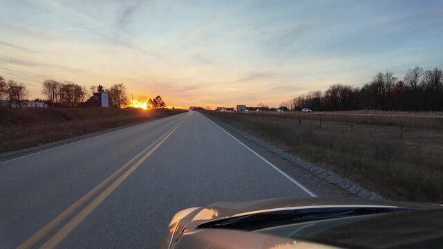 Driving on Highway Toward Sunset Over the Open Road