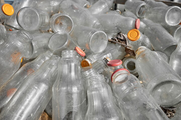 Used glass containers intended for recycling, selective focus.