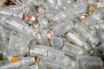 Used glass containers intended for recycling, selective focus.