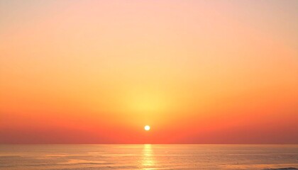 Obraz premium Vibrant ocean sunset with golden horizon and warm glowing sky