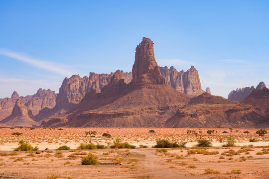Majestic sandstone spire rising from the desert floor in Wadi Al Disah near Tabuk in Saudi Arabia