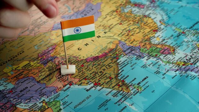 Hand sets India flag on detailed subcontinent map
