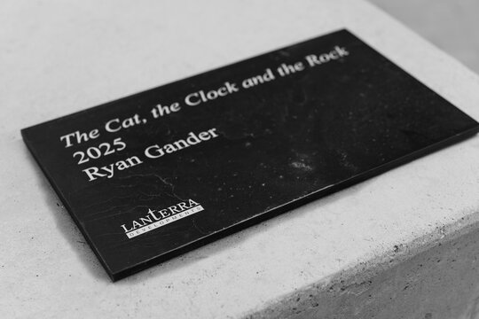 art installation label of Lanterra Developments, Ryan Gander, public artwork, &lsquo;The Cat, the Clock the Rock,&rsquo; Artists&rsquo; Alley condos, 234 Simcoe Street, Toronto