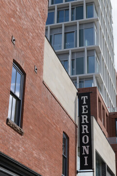 wall mounted projecting sign on the exterior of Terroni, an Italian restaurant chain, located here at 1095 Yonge St, Toronto