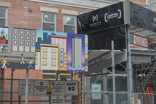 designed by IBI Group (now Arcadis), hoarding at 8 Elm, a 69-storey residential tower preserving the 1923 heritage facade of the Gerrard Building within its modern glass structure, Toronto