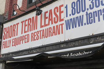 Naklejka premium old ghost banner sign for Short Term Lease, Fully Equipped Restaurant, Yonge St, Toronto