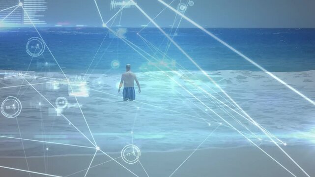 Senior man stepping from shore, wading into sea, HUD nodes mapping depth intensifying for tech test