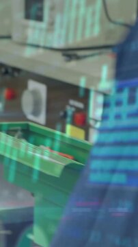 Vertical video: Plant worker leaning reaching bins as line moves, inspecting parts under cyan chart