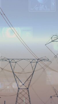 Vertical video: Central pylon emerging as camera zooming out, HUD overlays monitoring power lines