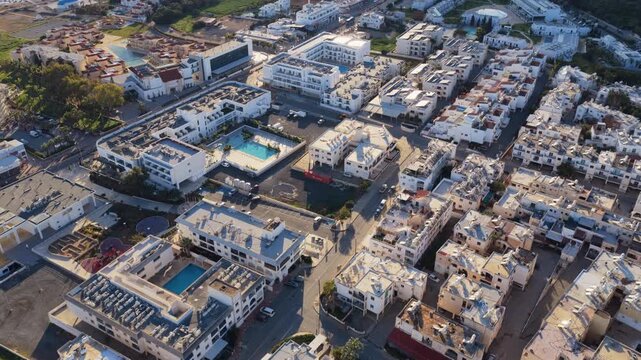 Aerial drone view of dense residential area in Cyprus, with compact buildings and Mediterranean urban layout