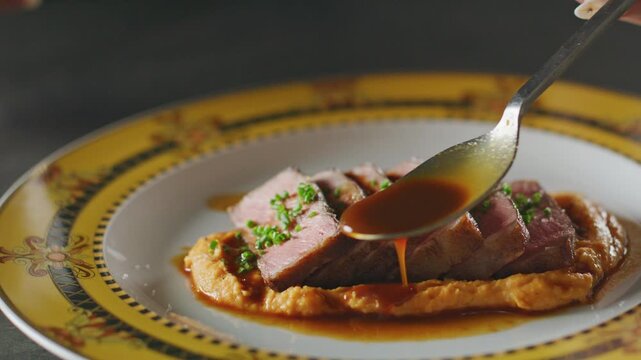 Tender NY strip slices on sweet potato mash, garnished with chives and drizzled with demi glace sauce.