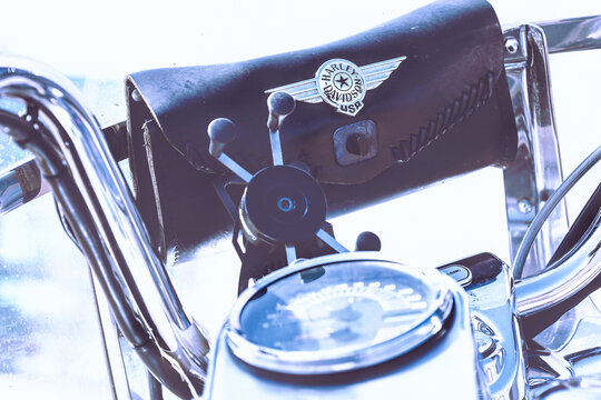 Poznan, Poland - April 2, 2026. Harley-Davidson logo on a leather bag fastened to a windshield of a classic Harley-Davidson chopper.