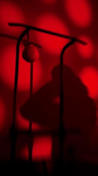 Noir Contender Punching In Emberlit Room, Brooding Vigil Silhouette Moving Against Scarlet Orbs, Cinematic Chiaroscuro, Ritual Prep With Steady Pacing And Smoldering Atmosphere