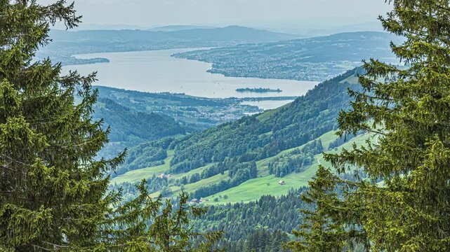 Time lapse, the lake of Zuerich, a long, glacial lake in canton Zuerich framed by rolling hills, lakeside towns, promenades and mountains in the distance. Switzerland.