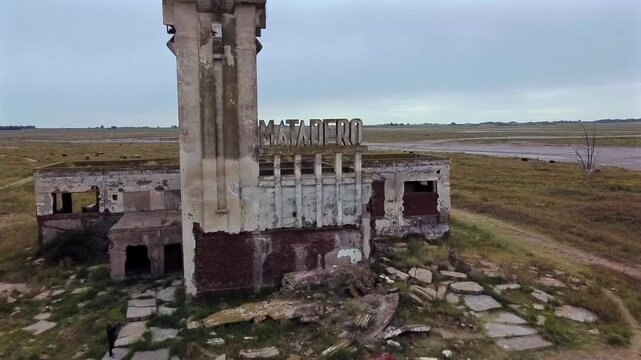 Close up of the concrete letters of the slaughterhouse indicating the site of the 1985 flood disaster in Villa Epecuen. Gloomy atmosphere.