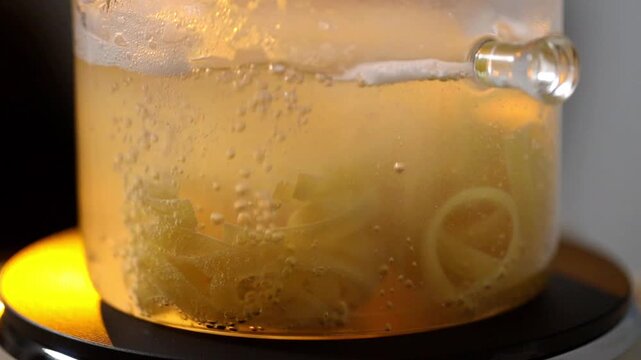 Pasta boiling in a transparent pot on a stove, showing a clean and minimal cooking process suitable for both home kitchens and professional restaurant environments.