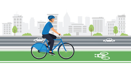 Fototapeta premium A focused male cyclist in a blue helmet rides a matching bicycle along a dedicated green bike lane with a grey city skyline and trees in the back now.