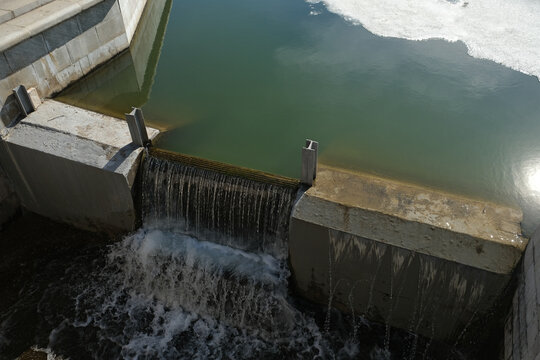 Stop Log Weir or Flashboard Dam. Water level control structure. Cascade weir and stilling basin. Regulation of water levels during floods and intense ice melting. Wooden dam