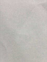 Fondo de papel texturizado con arrugas suaves en tono gris claro © Gabrieuskal