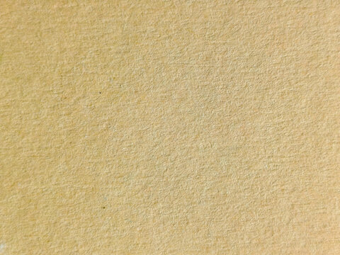 Textura de papel reciclado granulado en color beige ocre