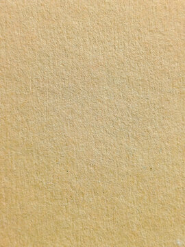 Textura de papel reciclado granulado en color beige ocre