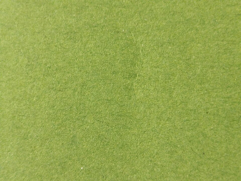 Textura de fieltro de color verde manzana con superficie de fibras entrelazadas para fondos de artesan&iacute;a y textil