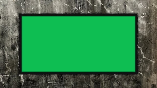 Grunge wall texture seamless loop stop motion animation with black rough frame green screen placeholder at center. 4K animated frame placeholder for overlay, background, and cinematic video editing.
