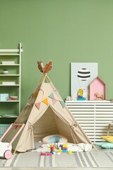 Cute wigwam and toys in stylish child's room © New Africa