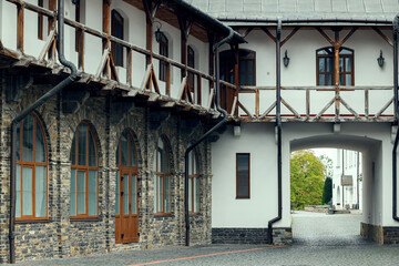 Naklejka premium historical building inside court yard Europe architecture cobble stone street and facade campus