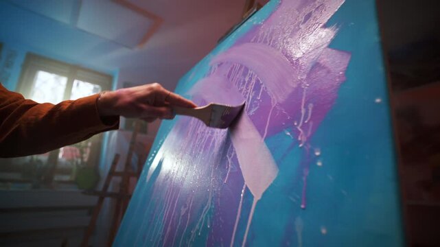 Wet Purple Paint Added To Canvas, Layering Moist Purple Color On Blue Surface Generates Glossy Reflections