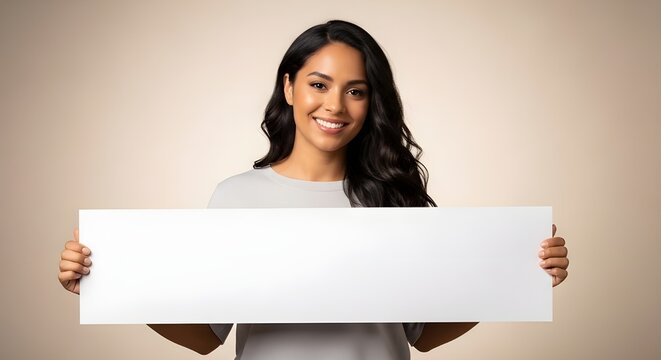 young woman holding blank sign for custom message or branding on beige background
