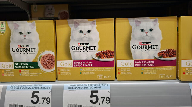 DENIA, SPAIN - December 10, 2025.Multipacks of Purina Gourmet Gold cat food on a supermarket shelf in Spain with different flavors for cats displayed
