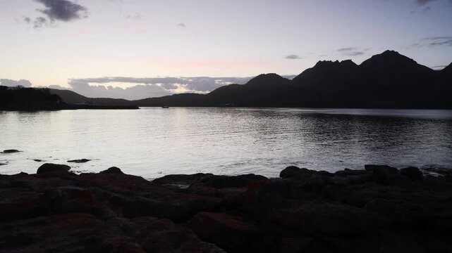 Sunrise timelapse over Coles bay coast to Freycinet National park The Hazards mountains.