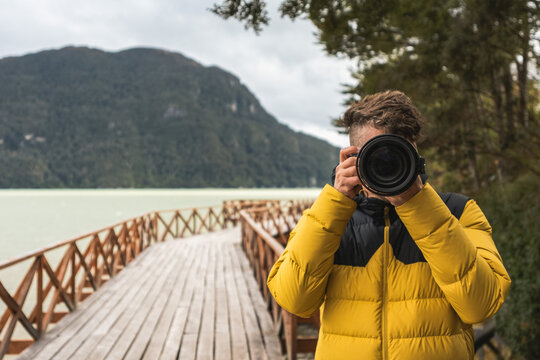 Close up of a photographer taking a picture in Caleta Tortel Patagonia Chile